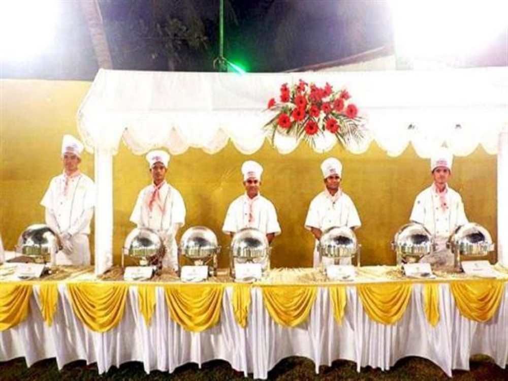 caterers serve food at wedding